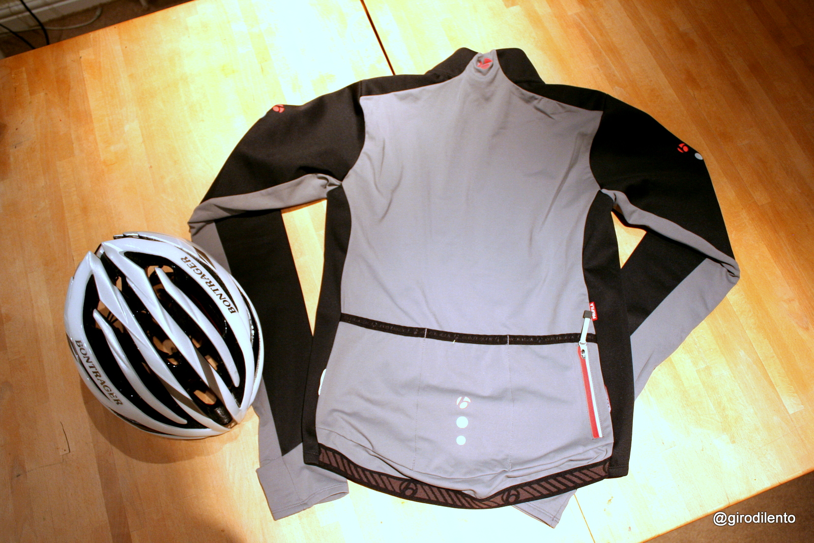 Bontrager RXL 180 Softshell jacket rear view & Bontrager Velocis helmet