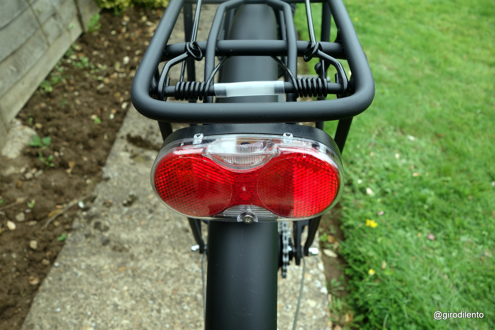 Battery operated rear light - not super bright but works well with good sized reflectors